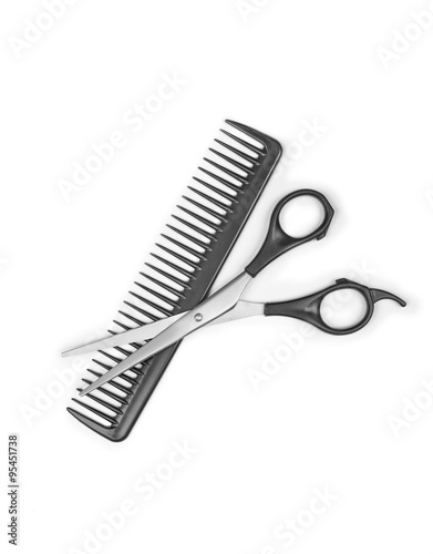 Comb and scissors isolated on the white background