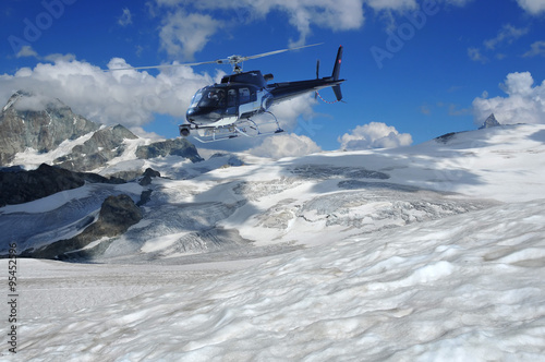 helicopter filming glaciers and the summit of the matterhorn photo