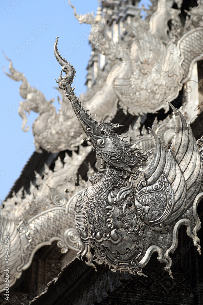 Traditional Chinese Phoenix on Silver roof of Buddhism temple, C