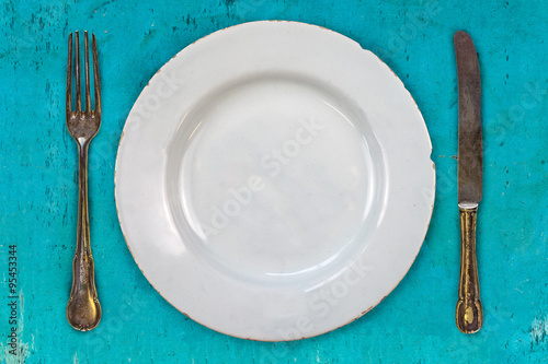 Retro styled image of an empty dinner plate