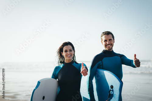 Photography Successful couple of surfers