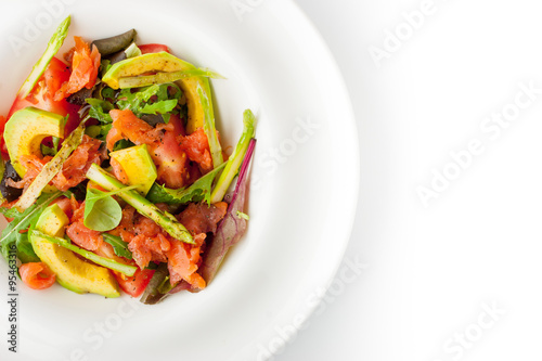 Salad with avocado , trout and asparagus on the white plate top view © deniskarpenkov