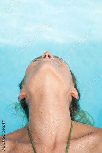 Beauty woman inside the pool