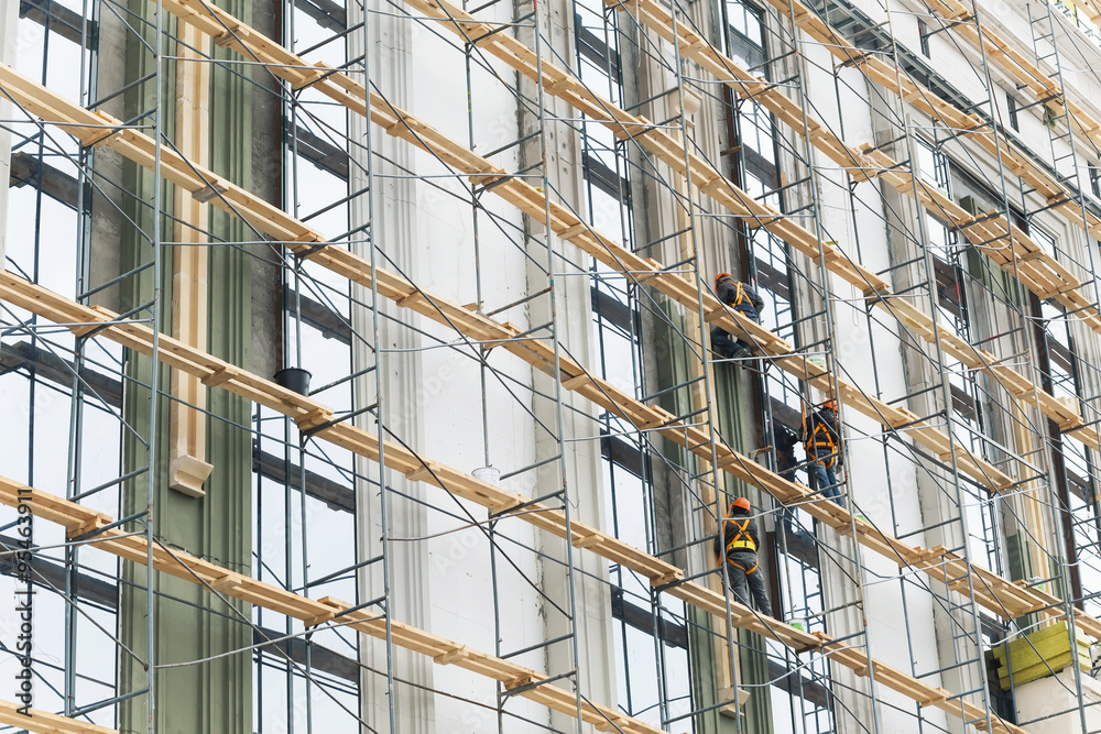 Building construction with scaffolding 