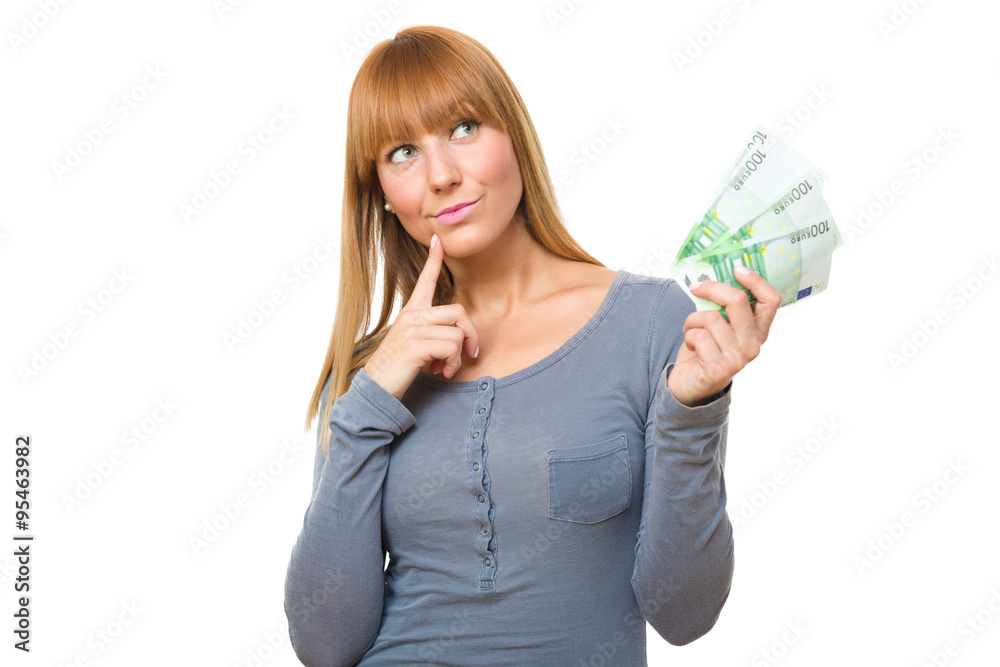 Beautiful young girl holding money and wondering on what to spend it, isolated on white background Beautiful young girl holding money and wondering on what to spend it, isolated on white background