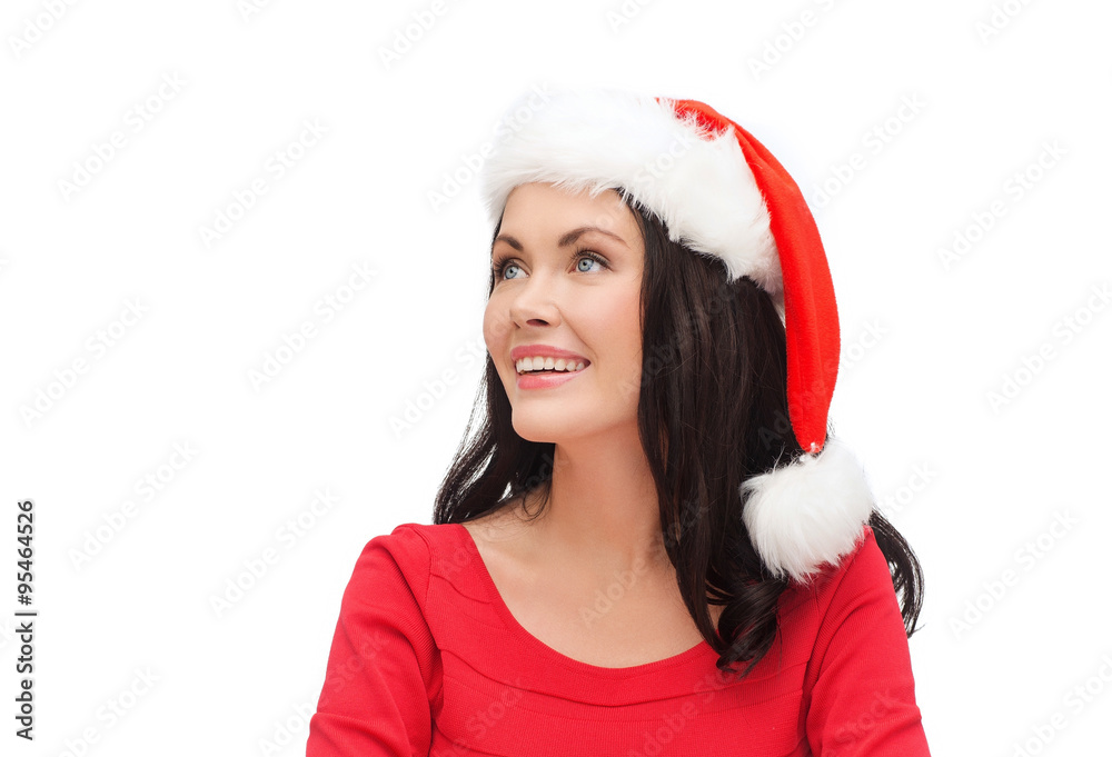 surprised woman in santa helper hat looking up surprised woman in santa helper hat looking up