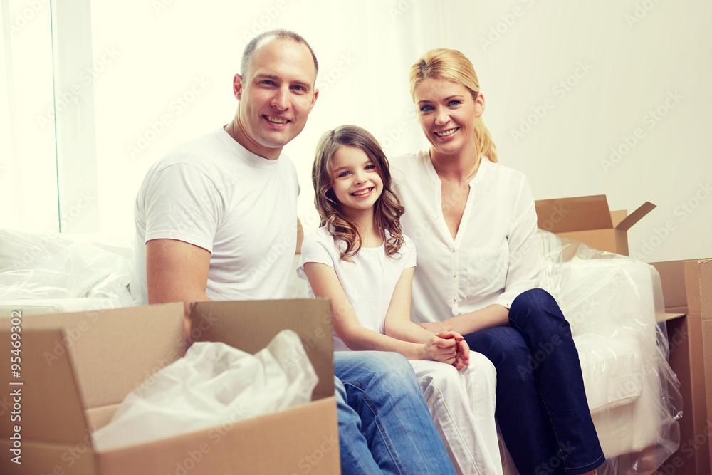 happy family with boxes moving to new home happy family with boxes moving to new home