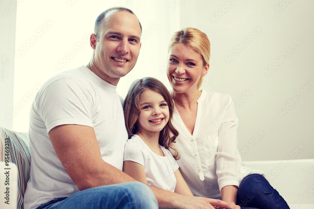 happy parents with little daughter at home