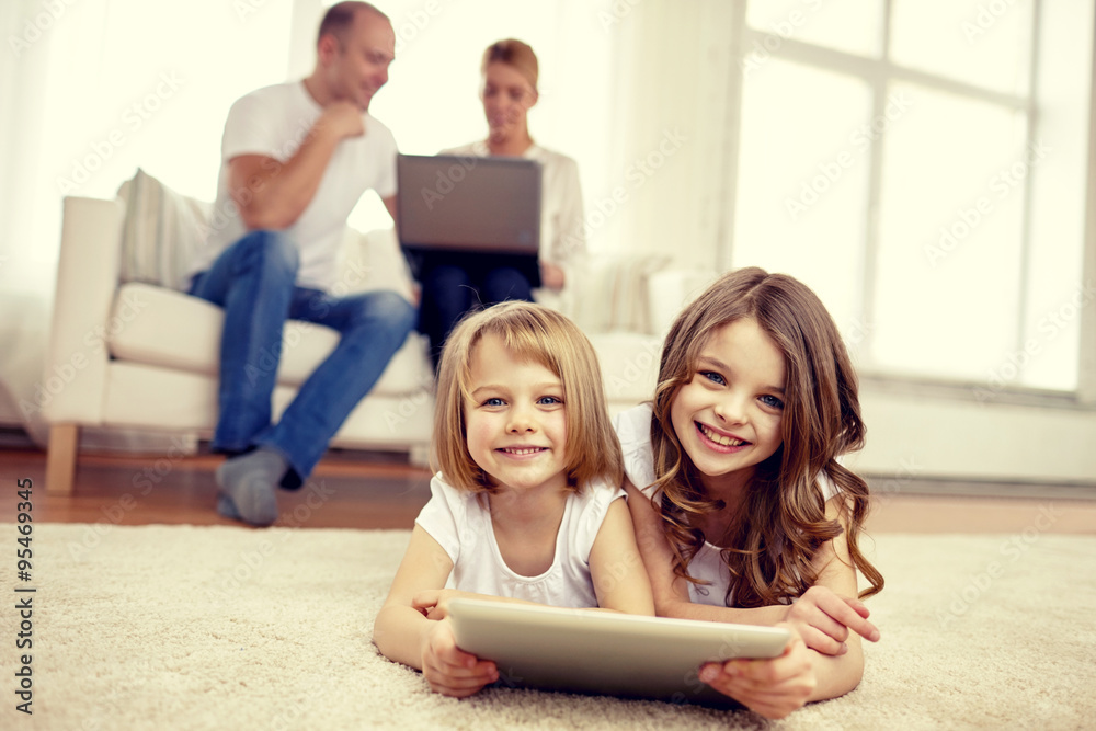 happy little girls with tablet pc computer at home happy little girls with tablet pc computer at home