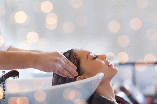 happy young woman at hair salon