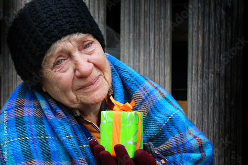 Homeless women with Christmas gift photo