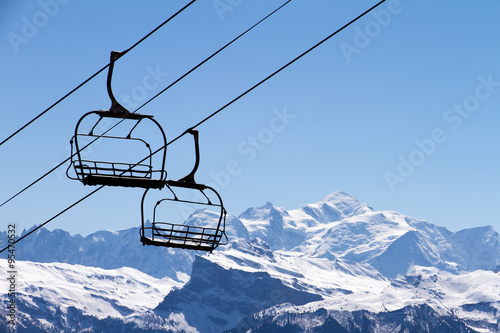 Chairlift seats in front of the mont blanc in the portes du soleil in France photo