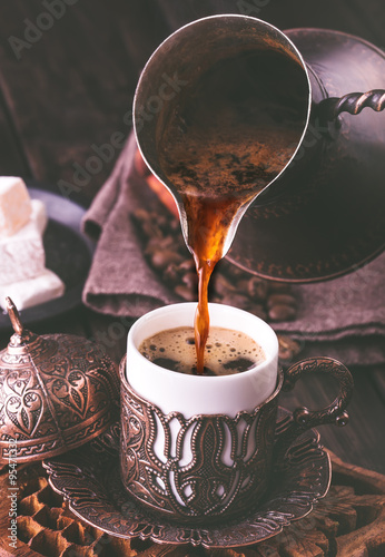 Pouring turkish coffee photo
