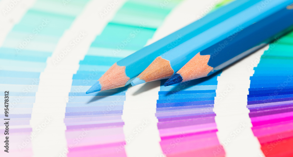 blue colored pencils and color chart of all colors Stock Photo Adobe