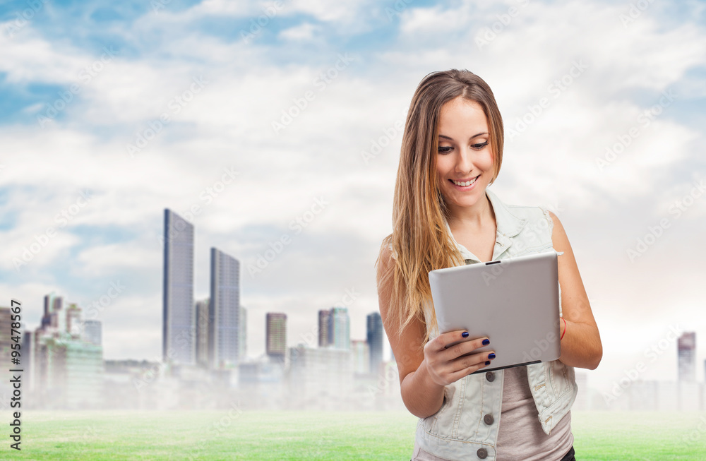 beautiful young woman using her white tablet beautiful young woman using her white tablet