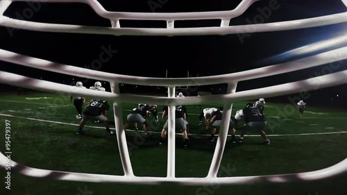 First person point of view from inside a football player's helmet, as the player makes a touchdown
 photo