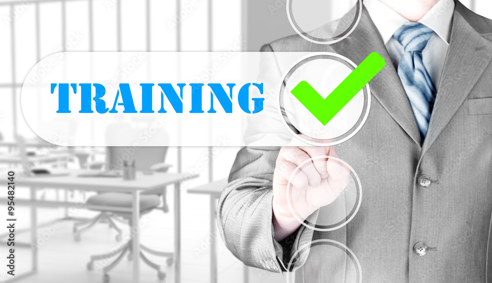 Businessman pressing touch screen interface training checkbox Businessman pressing touch screen interface training checkbox
