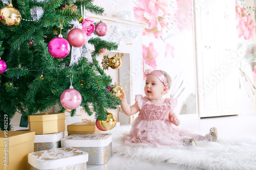 little girl at Christmas tree