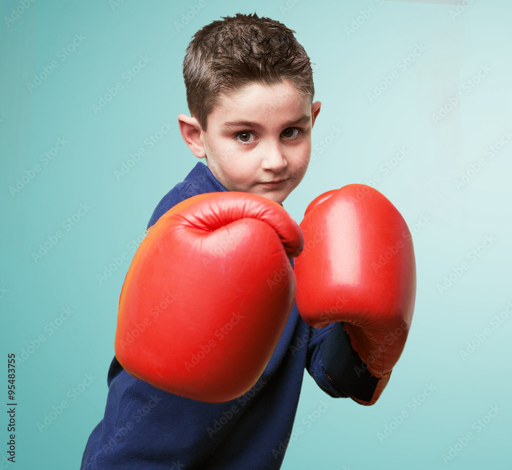 little kid fighting with red boxing gloves little kid fighting with red boxing gloves