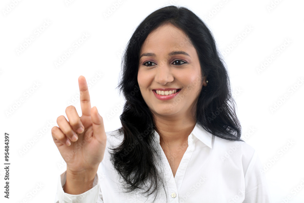 Young businesswoman touching virtual screen Young businesswoman touching virtual screen