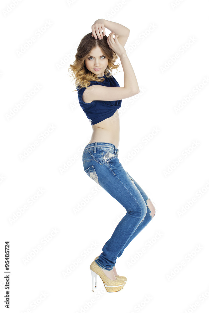Portrait in full growth the young girl in blue jeans Portrait in full growth the young girl in blue jeans