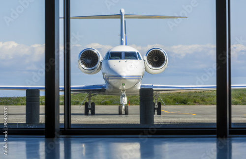 Private Corporate Jet Airplane at an Airport photo