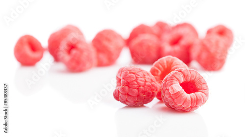 group of raspberries isolated on a white background