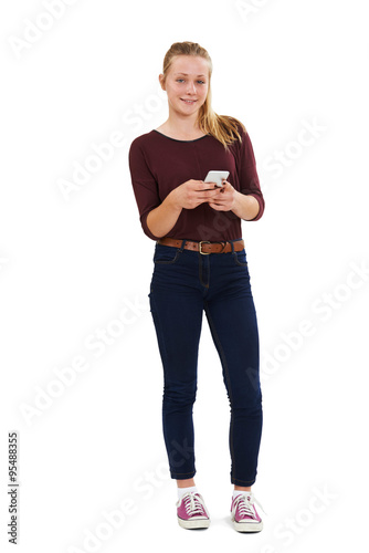 Bild auf Leinwand Studio Shot Of Teenage Girl Sending Text Message