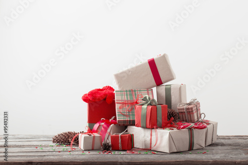 Christmas presents on old wooden table photo