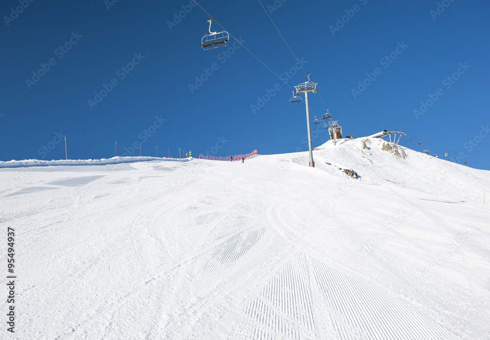 Snowy ski piste on a mountain
