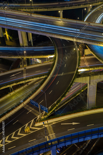 Modern city traffic road at night. Transport junction.