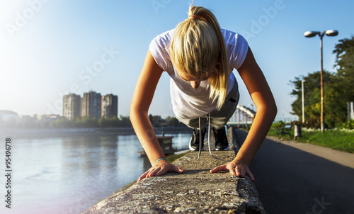 Sports girl doing push ups