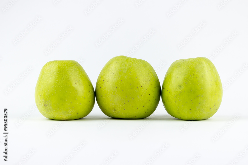 Three green apples on a white background Three green apples on a white background