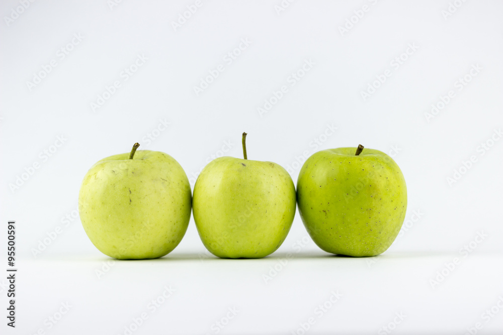 Three green apples on a white background Three green apples on a white background
