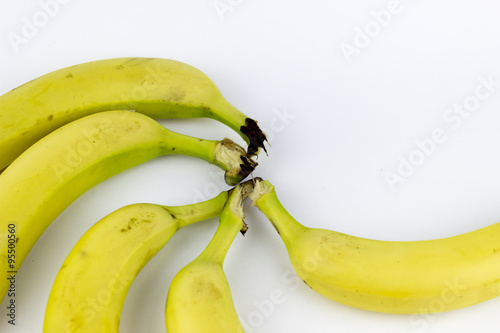Five bananas on a white background