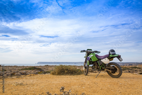 enduro motorcycle on the rock in Sagres  Portugal