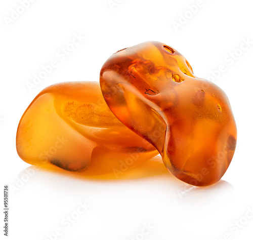Photo pieces of amber close-up isolated on a white background.