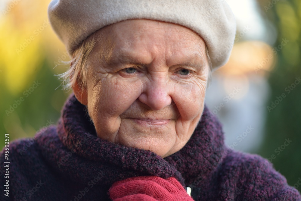 Senior woman smiling and dreaming in garden. Senior woman smiling and dreaming in garden.