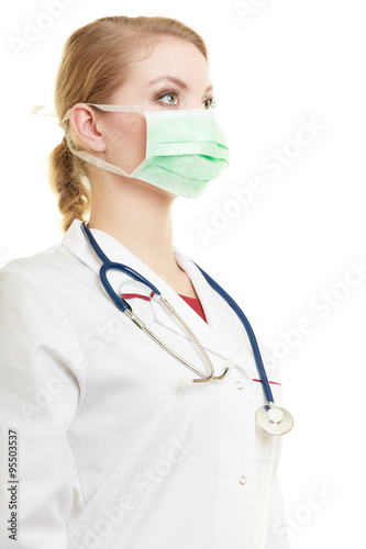 Young woman doctor in face surgical mask