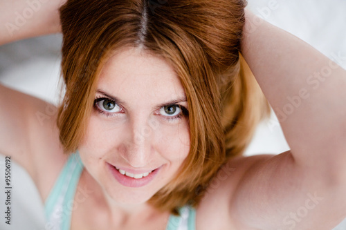 Portrait of beautiful red-haired girl face closeup
