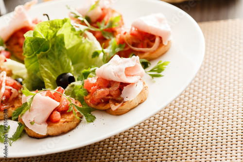 Bruschetta with tomato and ham