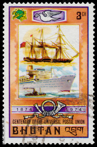 Stamp printed in Bhutan shows old and modern ship