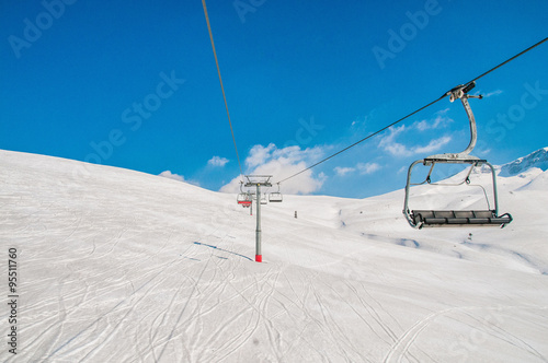 Ski lifts durings bright winter day