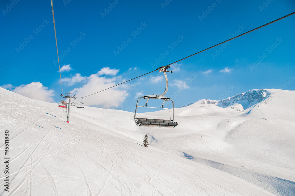 Ski lifts durings bright winter day Ski lifts durings bright winter day