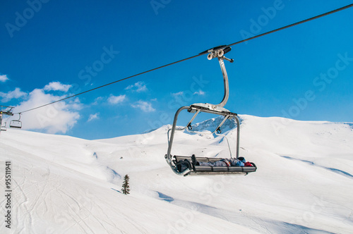 Ski lifts durings bright winter day