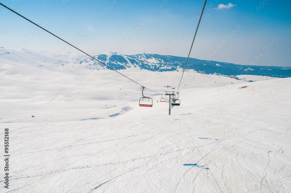 Ski lifts durings bright winter day Ski lifts durings bright winter day