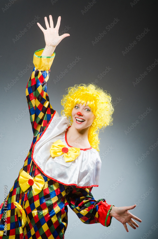 Clown in funny concept on dark background Clown in funny concept on dark background