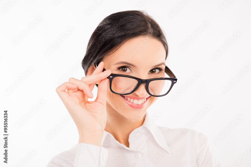 elegant business woman adjusts her glasses and smiling