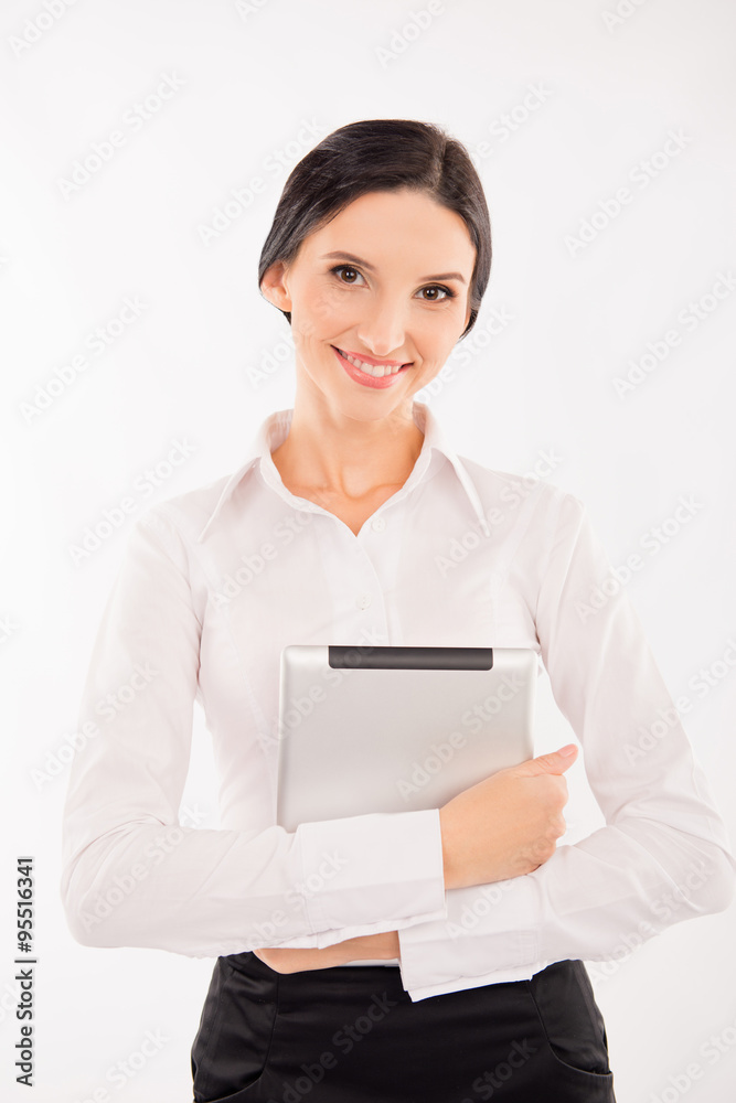 elegant smart woman in business clothes holding a tablet elegant smart woman in business clothes holding a tablet