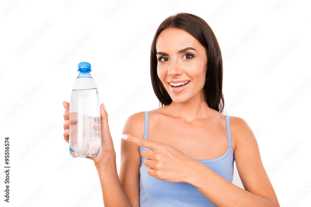 Slim pretty girl showing a bottle with water Slim pretty girl showing a bottle with water